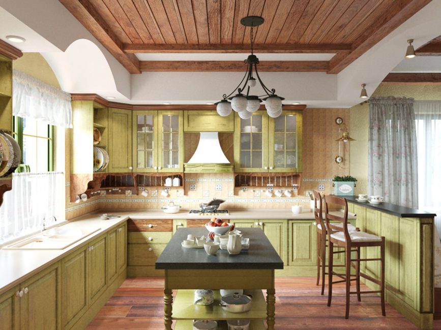 Cozinha de estilo provençal em cores verde-oliva claras com detalhes em madeira